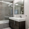 Modern gray bathroom with two tones of gray tile.