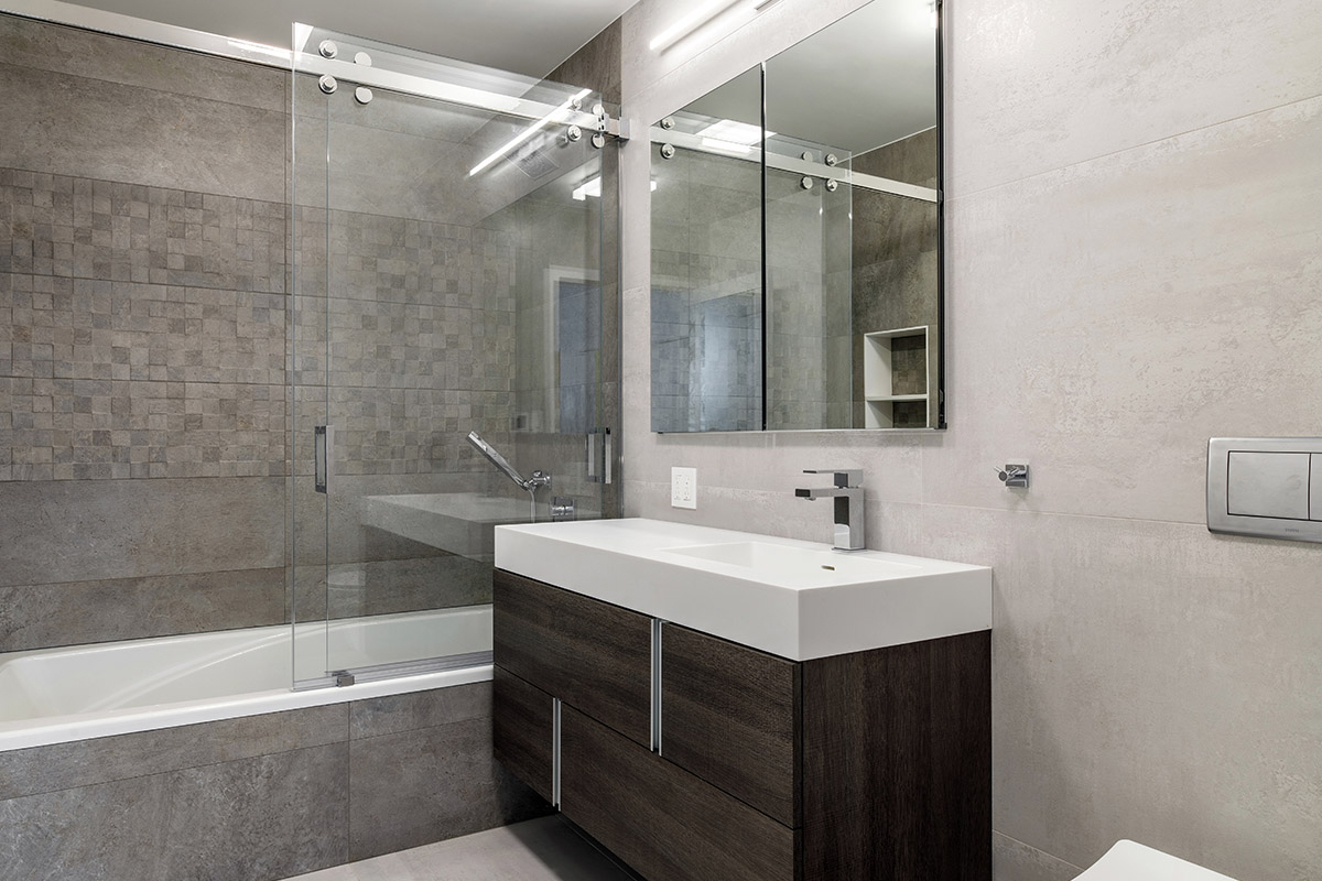 Modern gray bathroom with two tones of gray tile.