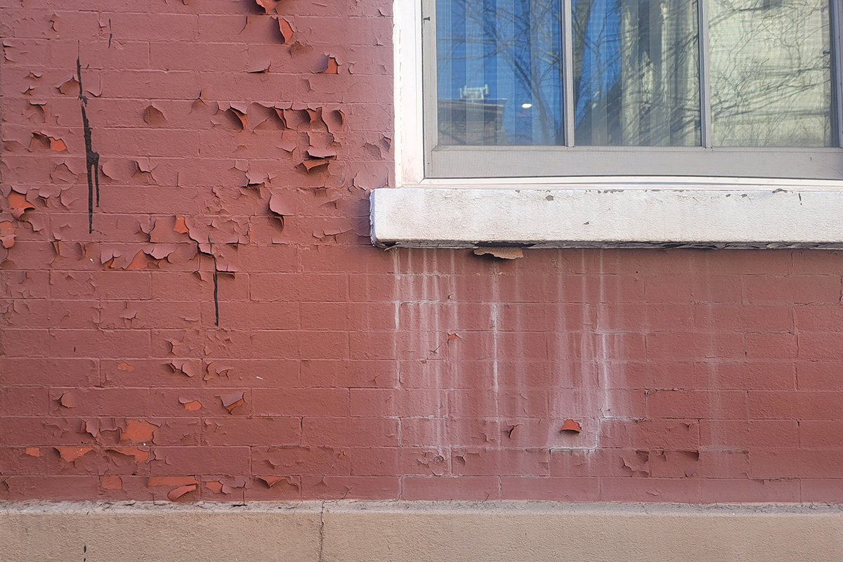 Painted Brick Facade with Peeling Paint