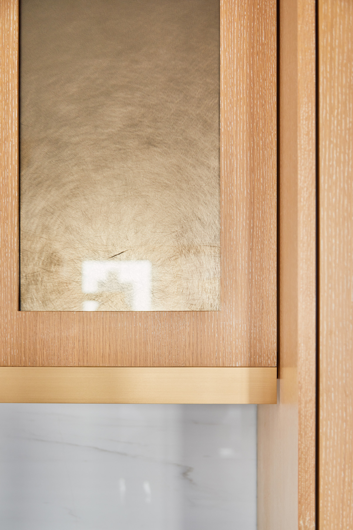 Kitchen Cabinets with Brass Metal Accent