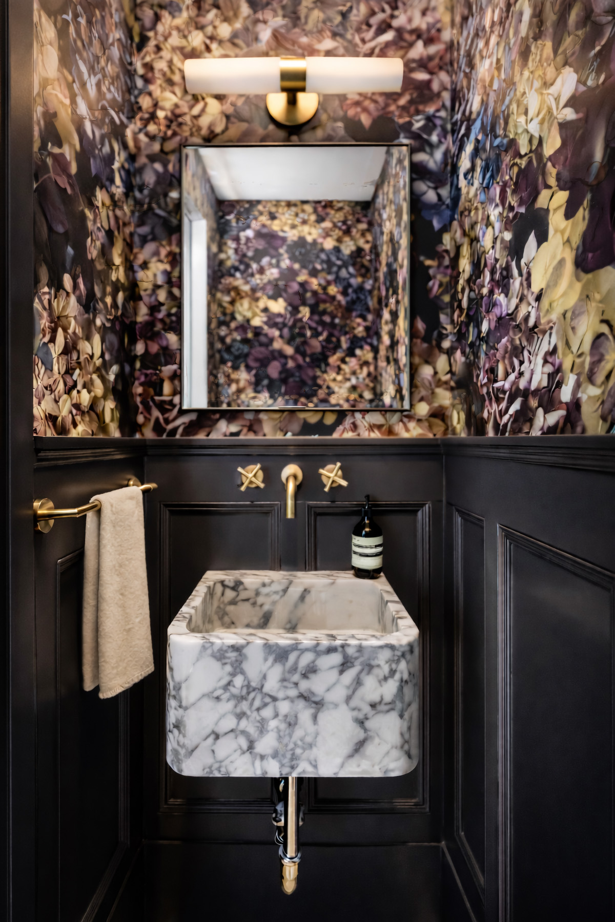 Brownstone Powder Room with Reclaimed Wood Paneling